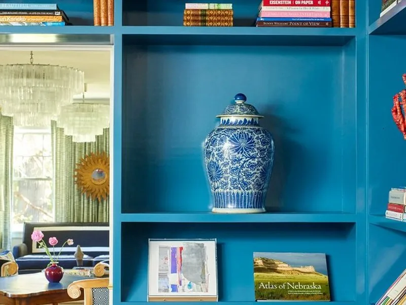The Westchester library, curated shelving, art books, and collected objects that tell the story of a life. Studio Eckström.