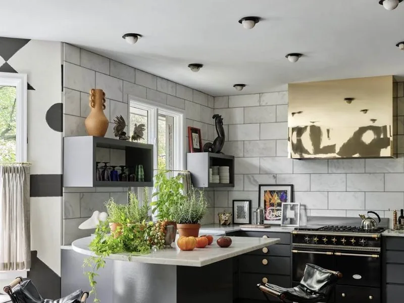 The Architectural Digest Townhome kitchen, Lacanche range, hand-laid marble tile, and precision craftsmanship. Studio Eckström.