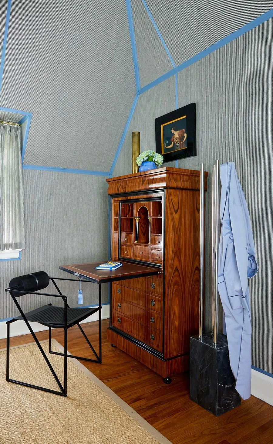 The Ticking Stripe Room, Biedermeier secretary cabinet, blue Murano vase, antique portrait, and modern black chair. The Dundee Remodel, Studio Eckström Omaha
